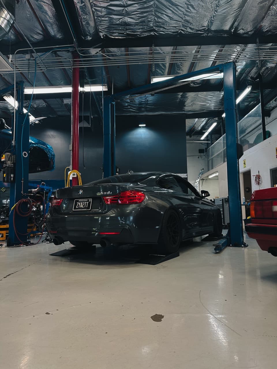 BMW on ramps in the EuroComp Garage service bay